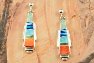 Genuine Turquoise, Spiny Oyster Shell and Blue Lapis inlaid between ribbons of Sterling Silver. Beautiful Post Earrings feature precision channel inlay. Designed by Navajo Artist Calvin Begay. Signed by the artist.